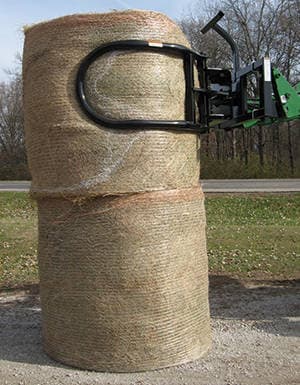 Worksaver’s New Bale Hand Rotates and Stacks Round Bales