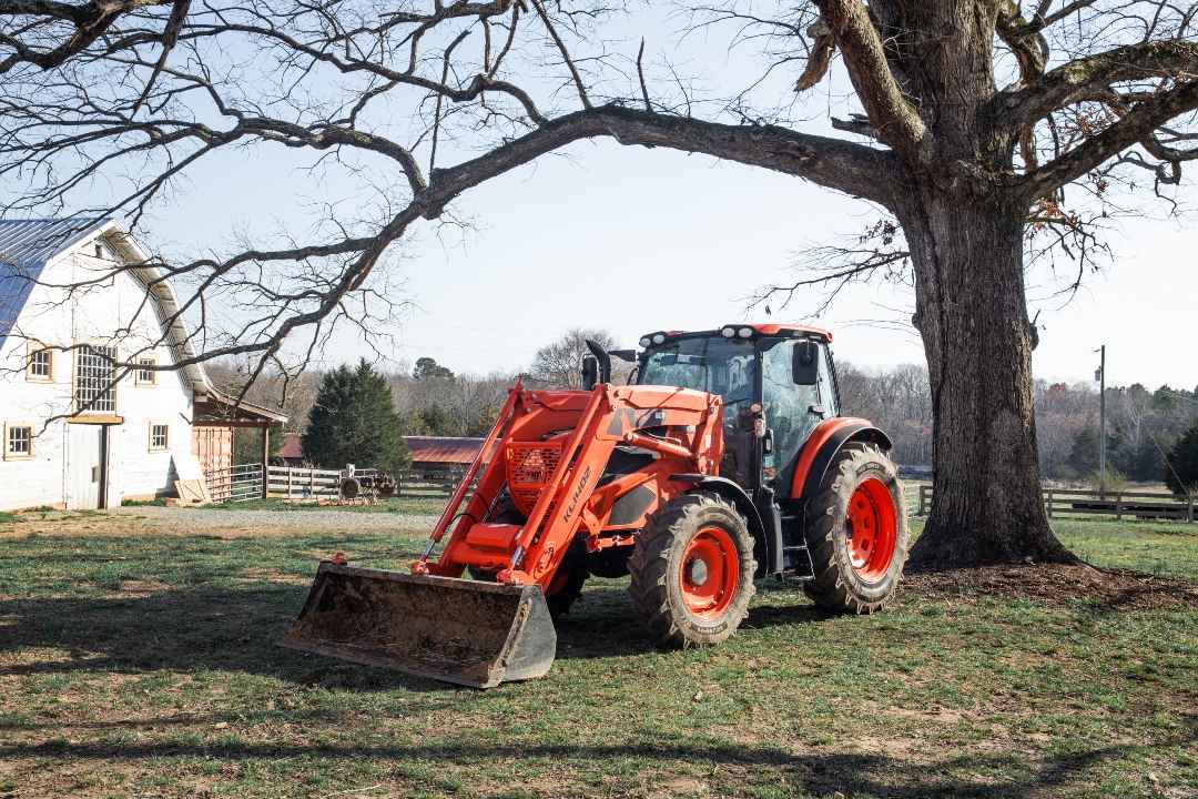 Tractor sitting under a tree
