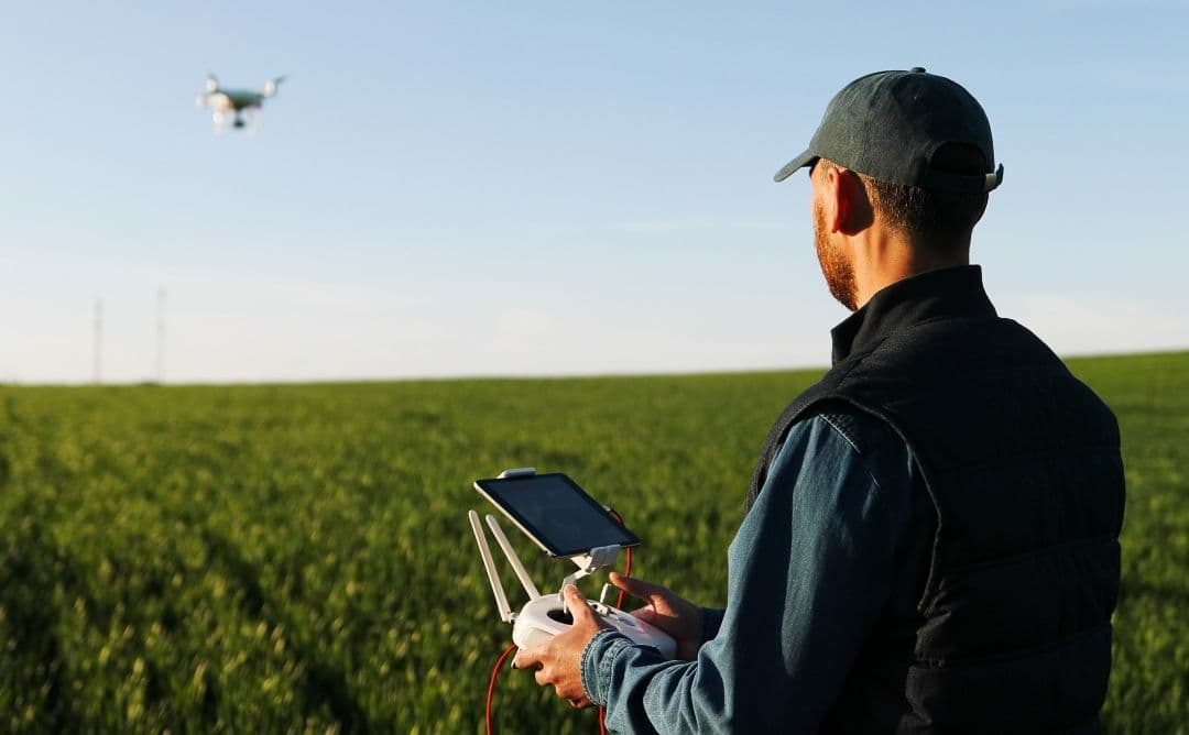 farmer scouting fields with drone technology